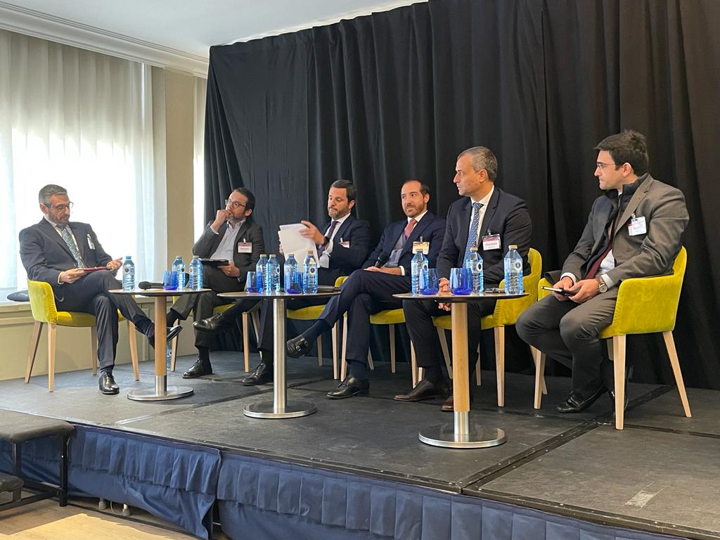 5th Annual NPL Iberia Event in Madrid by SmithNovak Juan Ramon Prieto GCOO of Hipoges Speech Panel Discussion Servicing Man holds microphone conference debate on stage market REO and NPL