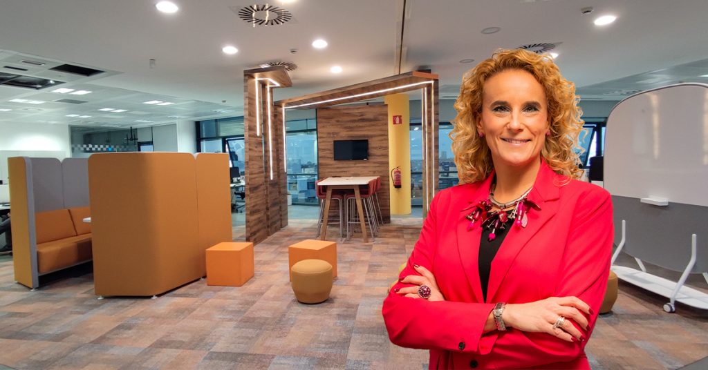 Mayka Vaquerizo, Team Coordenator of Office Management, at the  new Hipoges Madrid office after growth and evolution and more employees mdern design unity people working together team work